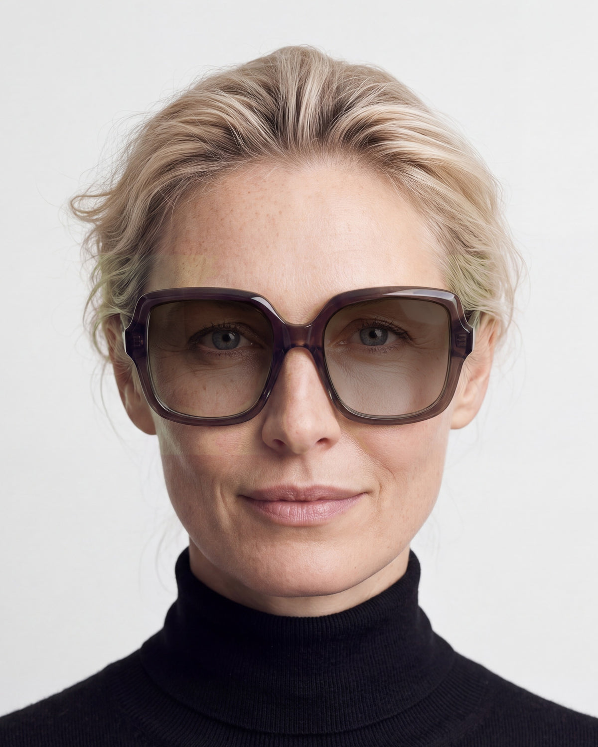 Elara in dark brown, worn, sun lenses