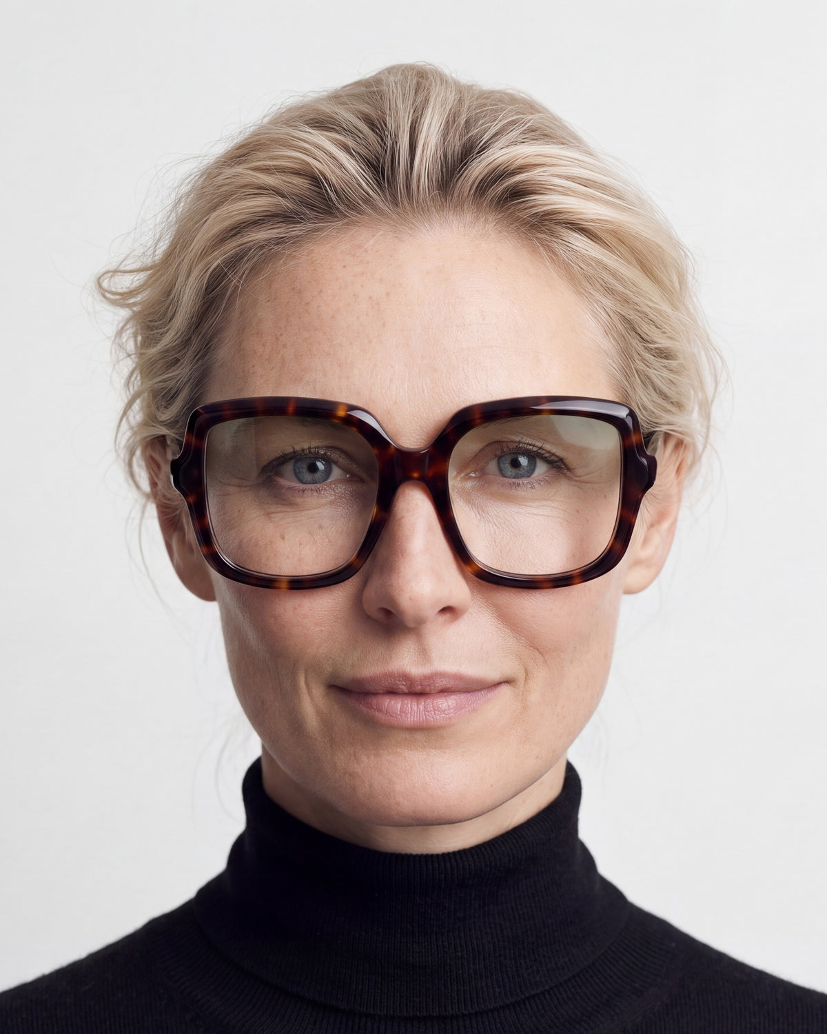 Elara in tortoiseshell, worn, Sage lenses