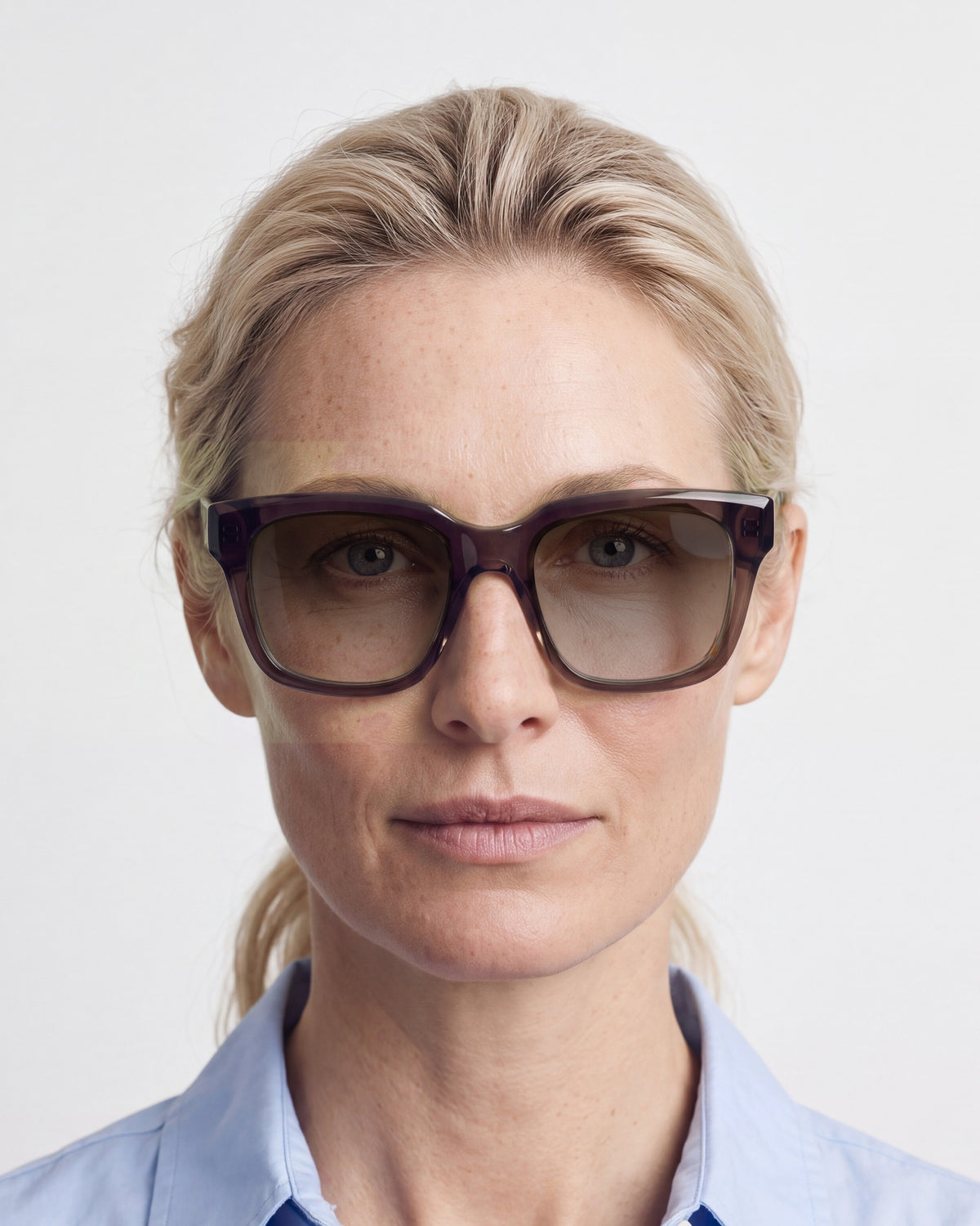 Therese in dark brown, worn, sun lenses